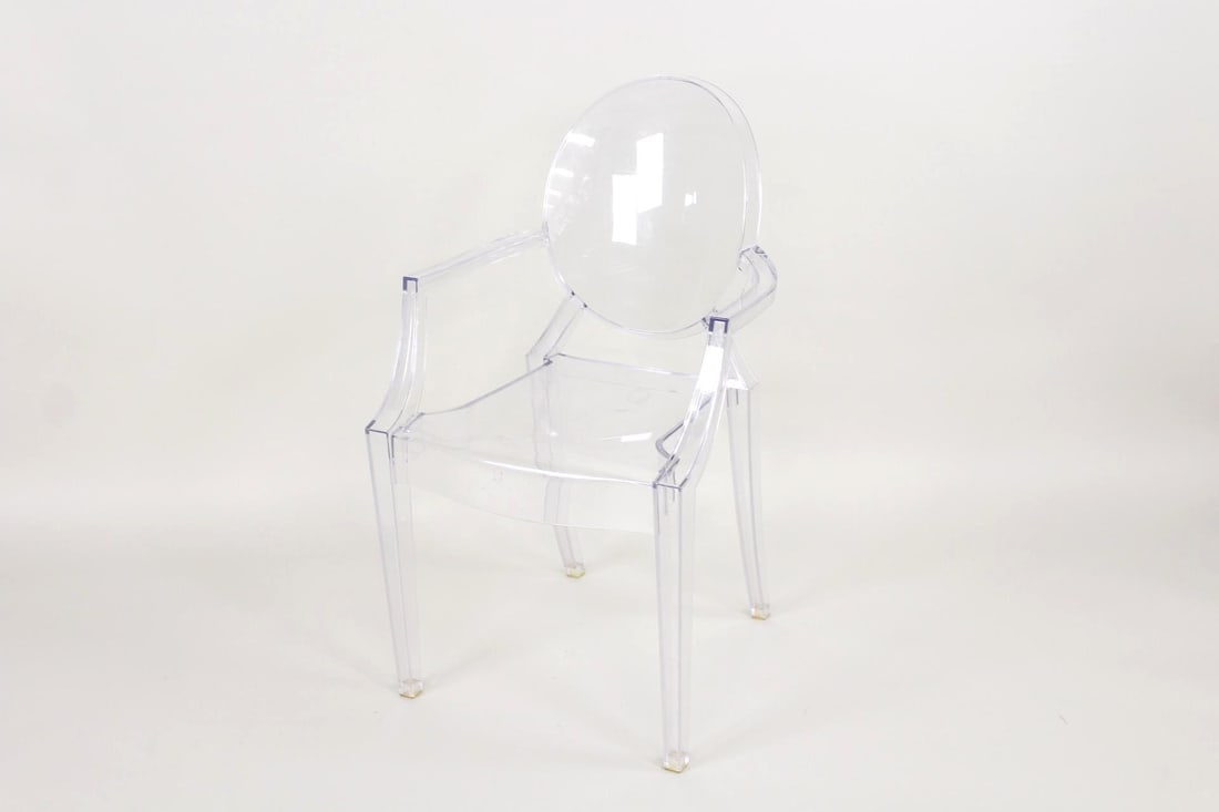 Transparent Plastic 'Louis Ghost' Armchair, Philippe Starck for Kartell: Transparent Plastic 'Louis Ghost' Armchair, Philippe Starck for Kartell. This contemporary sculptural chair of polycarbonate plastic has a regency style silhouette to the entirely clear structure. It