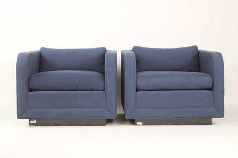 Pair of Upholstered Nicos Zographos Club Chairs: Pair of Upholstered Nicos Zographos Club Chairs. These cubist style armchairs have sloping front arms and a raised base, upholstered in a blue and red dotted fabric with matching seat cushions.