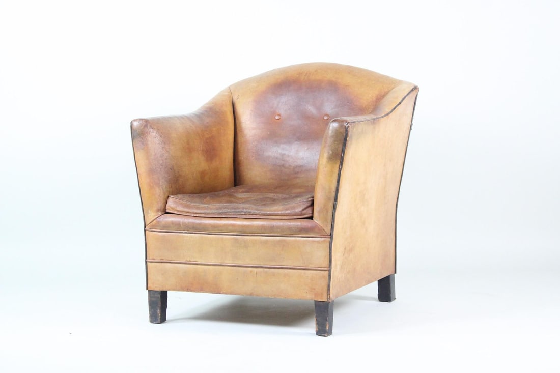 Bart van Bekhoven Leather Club Chair: Bart van Bekhoven Leather Club Chair. This minimalist armchair is raised on short feet and upholstered in a brown cognac leather throughout with contrast trim piping. No maker's mark, we believe this 