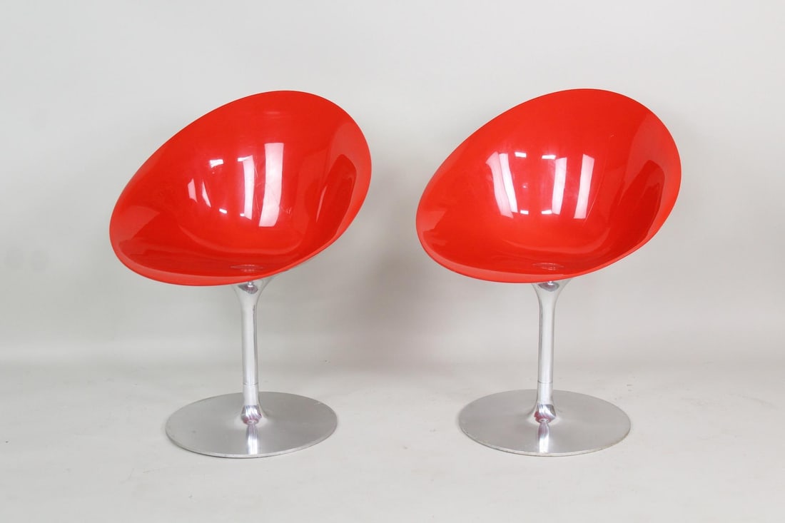 Pair of 'Eros' Swivel Chairs, Philippe Starck for Kartell: Pair of 'Eros' Swivel Chairs, Philippe Starck for Kartell. These space age chairs have molded red plastic scoop seats on metal bases in the tulip design. Marked on base as Eros by Kartell with Starck,