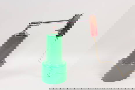 Green Vistosi Murano Glass Wall Mounted Sconce Light: Green Vistosi Murano Glass Wall Mounted Light. This fixture has a stepped cylindrical green glass lamp shade at the end of the metal arm that connects to the wall mounting plaque. Marked with a sticke