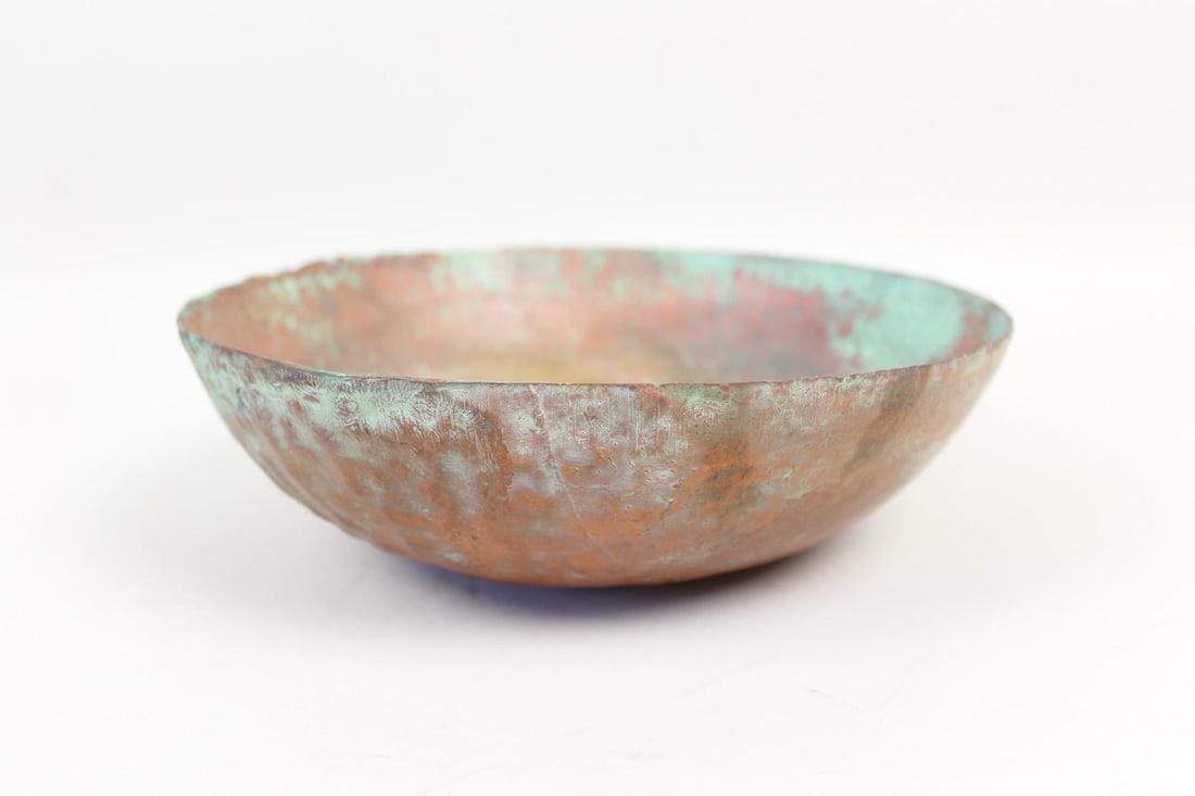 Shallow Heavy Bronze Etruscan Libation Bowl: Shallow Heavy Bronze Etruscan Libation Bowl. This thin hammered metal dish has lace-like vein impressions and an uneven handmade rim,with aged green patina all over. Dimensions are 3in h x 9 in w x 9 