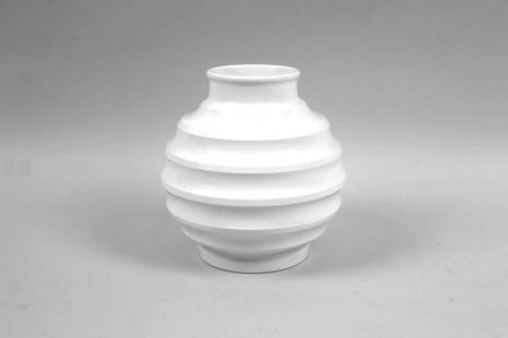 Keith Murray Wedgwood White Bomb Vase: Keith Murray Wedgwood White Bomb Vase. With glossy glaze and marked KM Wedgwood, Made in England. Dimensions are 7.75 in h x 6.5 in w x 6.5 in d. Condition is good with minor wear. Please call or emai