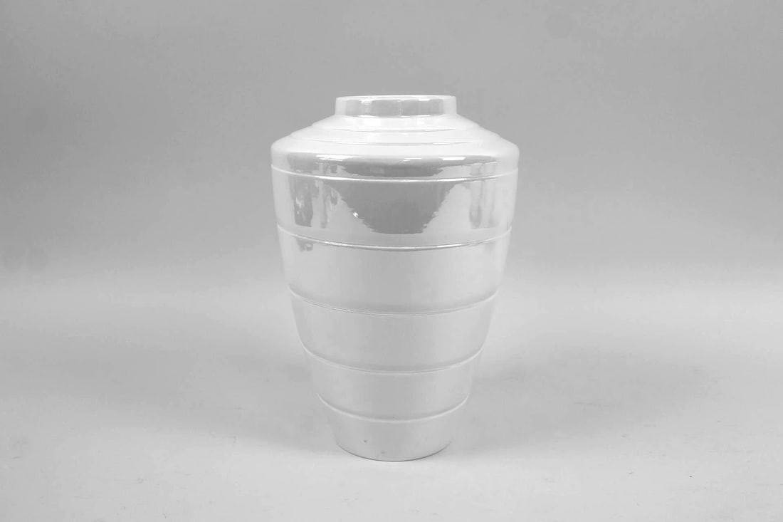 Keith Murray Wedgwood Moonstone Banded Vase: Keith Murray Wedgwood Moonstone Art Deco Banded Vase. Glazed in an opalescent finish and marked Wedgwood, this is a more recent reproduction of Murray's Art Deco design. Dimensions are 11.25 in h x 7