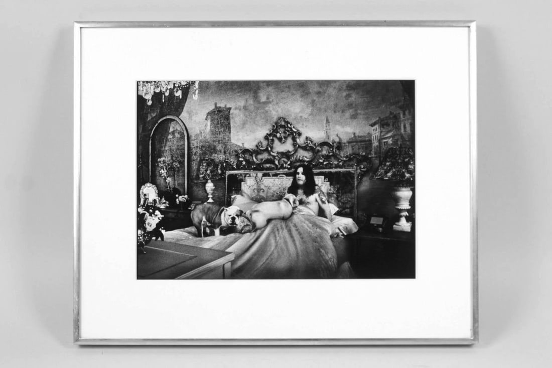 Framed Guzman Photo of Ozzy Osbourne in Bed: Framed Black & White Guzman Photo of Ozzy Osbourne in Bed with Dogs. This candid photograph of Black Sabbath lead singer Ozzy Osbourne shows him in a baroque bedroom with two dogs, in a metal frame. N