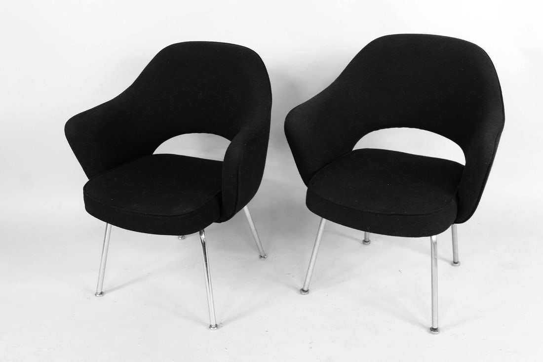 Pair of Saarinen Knoll Executive Armchairs, 1 of 6: Pair of Saarinen Knoll Executive Armchairs, 1 of 6. These chairs, originally produced as mid-century designs by Eero Saarinen, feature black fabric upholstered on the seat cushion and curved back rest