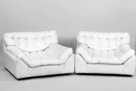 Pair of Oversized Faux Leather Lounge Chairs, Lennart Bender Style: Pair of Mid-Century Modern Oversized Faux Leather Lounge Chairs, Lennart Bender Style. These 2 low armchairs are upholstered in a white faux leather vinyl material, with tufted seat cushions. Dimensio