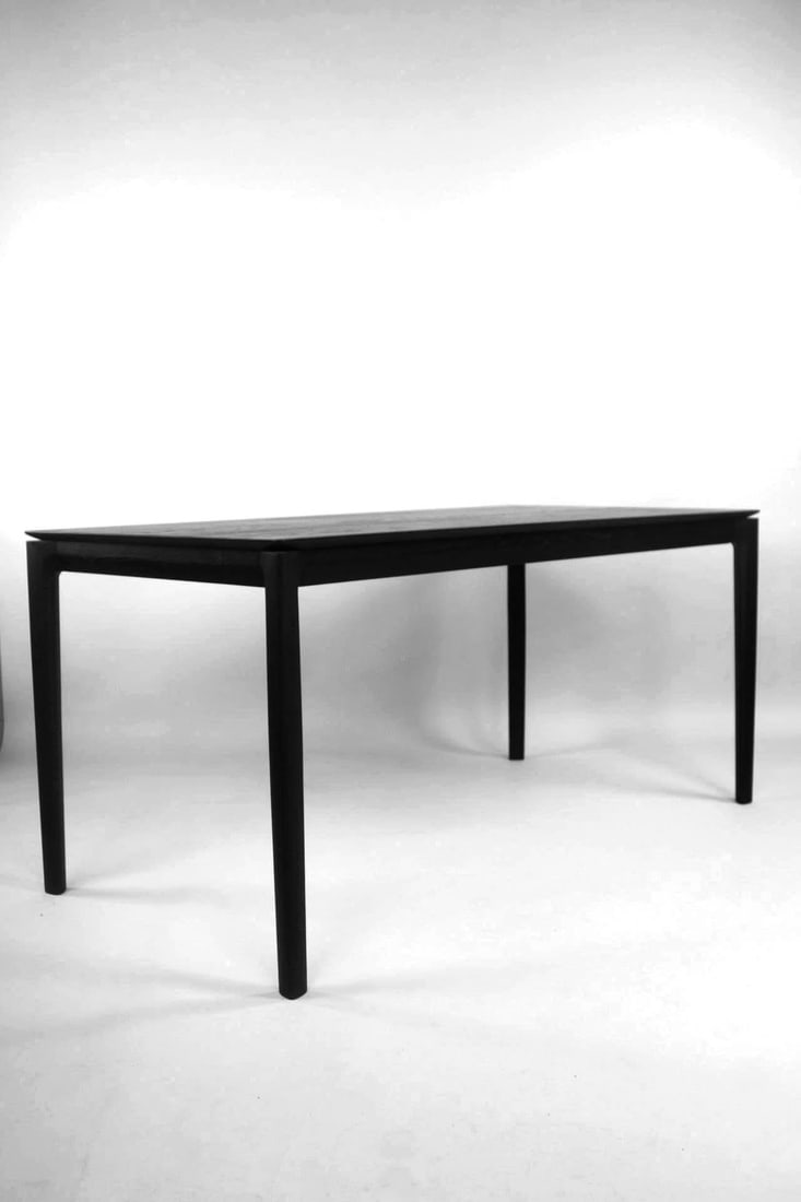 Black Oak Wood 'Bok' Table, Ethnicraft: Black Oak Wood 'Bok' Table, Ethnicraft. This minimalist contemporary wooden table has a sculptural top with beveled edge and finished in black. No maker's mark, we believe this is the 'Bok' table by A