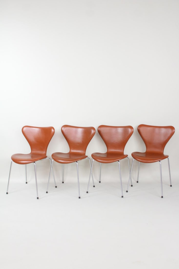 Set of 4 Arne Jacobsen for Fritz Hansen Series 7 Leather Chairs: Set of 4 Mid-Century Modern Arne Jacobsen for Fritz Hansen Series 7 Leather Chairs. Chairs stack and are upholstered in cognac leather. Contemporary Fritz Hansen labels attached to undersides.Dimensio