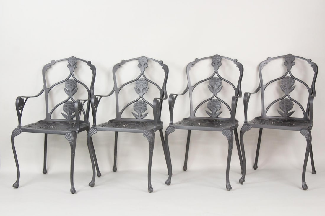 Set of 4 Cast Aluminum Outdoor Armchairs, Oxley's: Set of 4 Cast Aluminum Outdoor Armchairs. These chairs have a flower back design. Very sturdy and well made, believe to be contemporary made by Oxley's. Dimensions are 36.75 in h x 20 in w x 18 in d. 