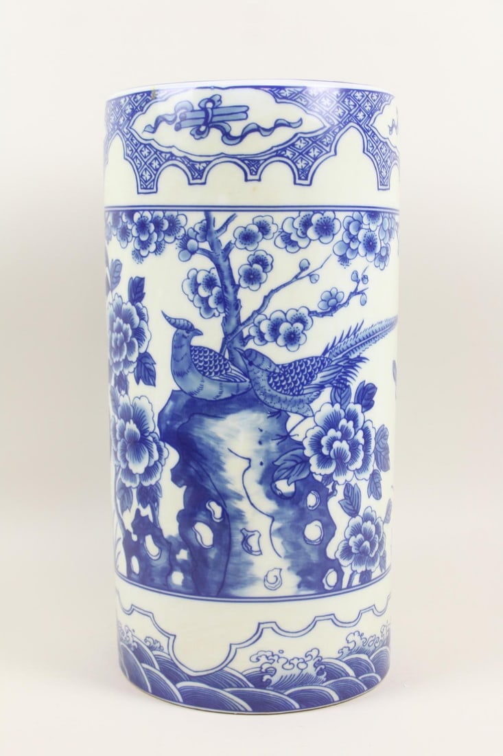 Chinese Blue & White Bird Motif Porcelain Umbrella Stand: Chinese Blue & White Bird Motif Porcelain Umbrella Stand or Floor Vase. Vessel made of white porcelain with blue decoration. Dimensions are 18.75 in h x 9 in w x 9 in d. Condition is good with minor w