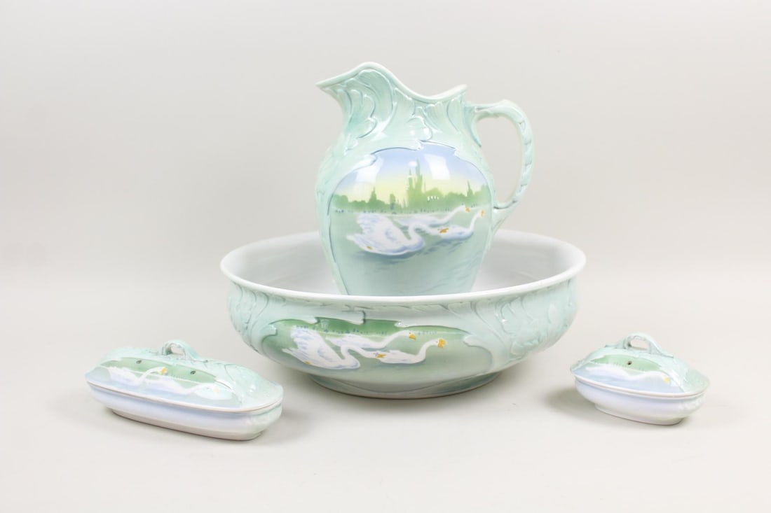 Ironstone Lot; 5 Pc Boch Freres Swan Bath Set: Ironstone Lot; 5 Pc Boch Freres Swan Wash Basin Set. Includes a pitcher, bowl, covered soap dish and covered vanity dish, all with celadon glaze and decorated with swans .Marked by the Belgian company