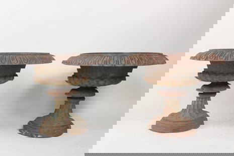 Pair of Wide Cast Iron Urn Planters on Pedestal: Pair of Cast Iron Urn Planters on Pedestal, minor remnants of green paint. Great wide iron planters, nice patina to the surface. Dimensions are 19 in h x 25 in w x 25 in d. Condition is good
