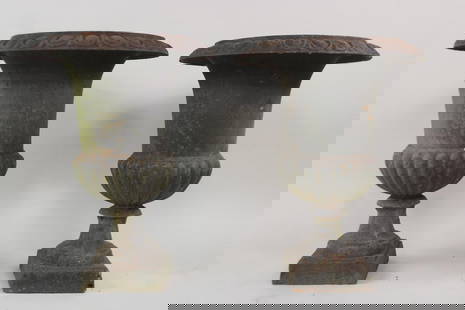 Pair of Black Cast Iron Planters on Pedestal: Pair of Black Cast Iron Planters on Pedestal. Great iron planters with nice patina to the surface. Dimensions are 24.75 in h x 19 in w x 8 in d. Condition is good overall. One has a hole in the