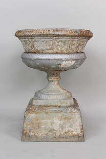 Antique Silver Painted Cast Iron Urn Planter: Antique Silver Painted Cast Iron Urn Planter. The urn is 4 pieces stacked. Dimensions are 29.5 in h x 22 in w x 16 in d. Condition is fair. One small rust hole see photos, structurally solid.