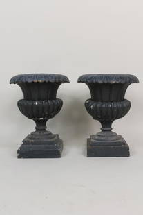 Pair of Antique Green Painted Cast Iron Urn Planters: Pair of Antique Green Painted Cast Iron Urn Planters. Each urn is 4 pieces stacked. They came together but the bases have a slight height difference. Dimensions are 20 in h x 15 in w x 10.5 in d.