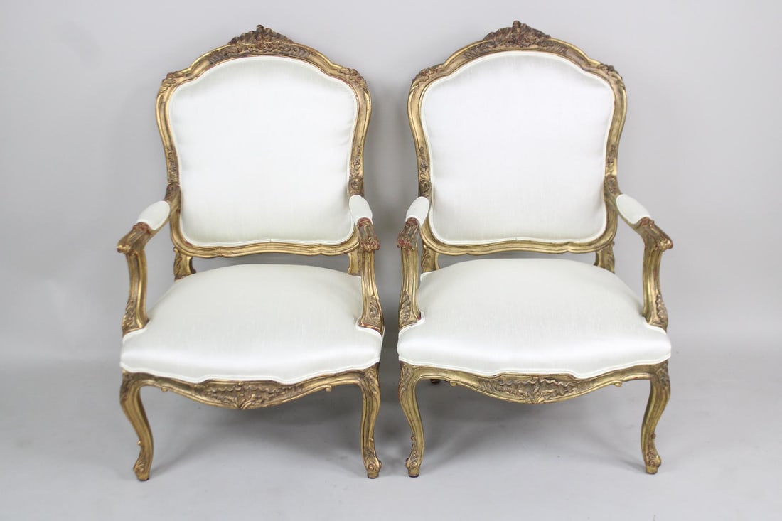 Pair of Carved and Gilt Wood French Louis XVI Style Linen Male Chairs: Pair of Carved and Gilt Wood French Louis XVI Style Linen Male Chairs. This is a very nice antique carved and gold gilt wood framed chairs with newly upholstered linen. We have a match to this in anot