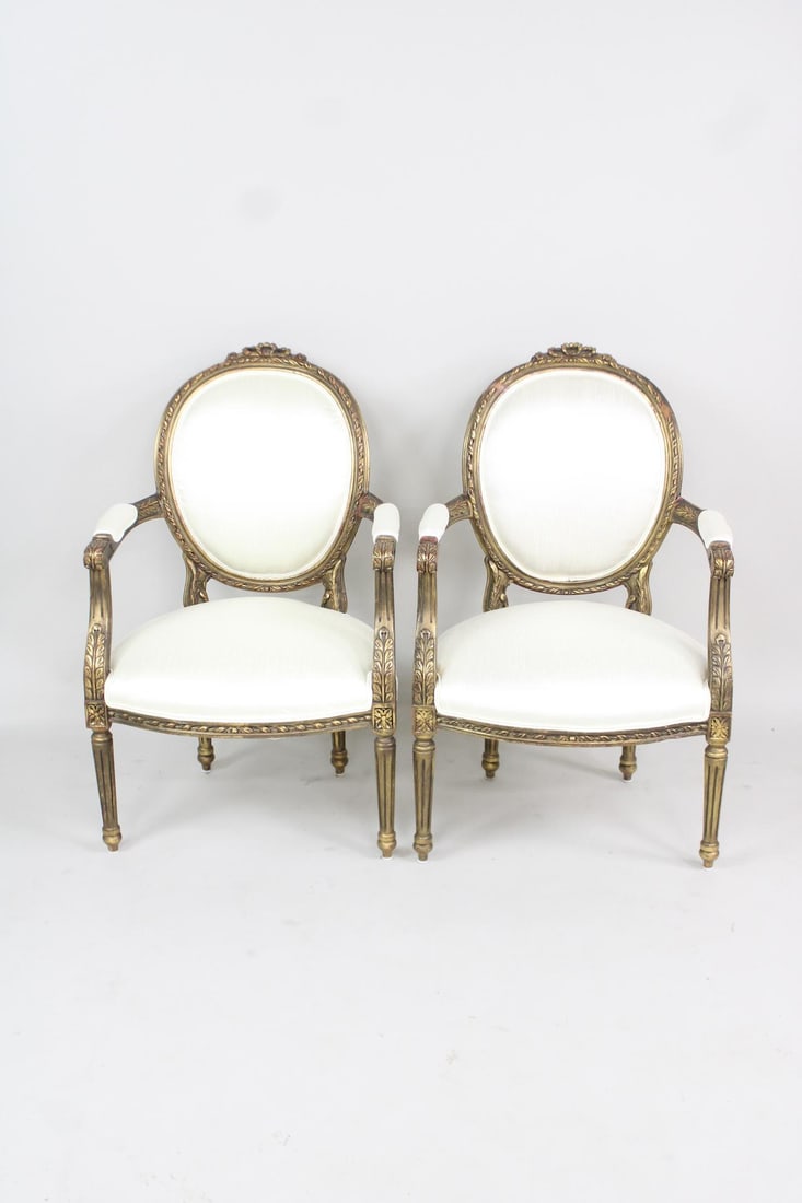 Pair of Carved and Gilt Wood French Louis XVI Style Linen Female Chairs: Pair of Carved and Gilt Wood French Louis XVI Style Linen Female Chairs. This is a very nice antique carved and gold gilt wood framed chairs with newly upholstered linen. We have a match to this in an