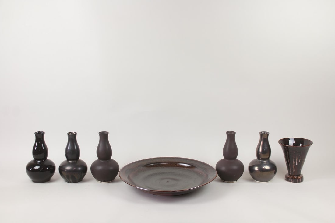 Lot of 7 Black & Brown Ceramic Vessels, John Thompson: Lot of 7 Black & Brown Ceramic Vessels, John Thompson.This contemporary pottery grouping with black and brown glazes includes 6 vases and charger plate. Two are marked with John Thompsonfor John Boone