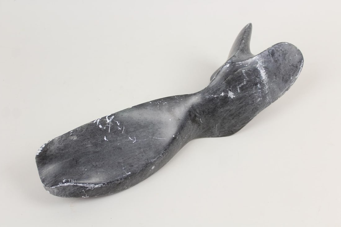 Inuit Carved Soapstone Abstract Sculpture: Inuit Carved Soapstone Abstract Sculpture. First Nations carved stone sculpture, in a free form suggestive of a whale's tail. Dimensions are 4.25 in h x 15.5 in w x 4.5 in d. Condition is good with sc