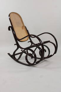 Mid Century Modern Bentwood Thonet Style Rocking Chair: Mid Century Modern Bentwood Thonet Style Rocking Chair. Classic chair with caned seats. Dimensions are 39.25 in h x 21.75 in w x 34.5 in d. Condition is very good. Please call or email for a detailed