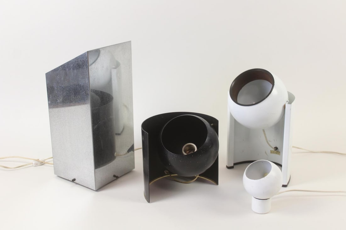 Lot of 4 Mid Century Modern Spotlight Lamps, George Kovacs Chrome: Lot of 4 Mid Century Modern Spotlight Lamps, George Kovacs Chrome. These are all space age spotlight type lamps. The black ball shaped one is missing a bolt. The chrome trapezoid lamp is designed by G