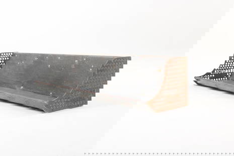 Metal and Cast Iron Leesona Industrial Wall Shelf: Metal Leesona Industrial Wall Shelf. Metal shelf has perforated cast iron sides. It has a lower and upper shelf with rounded edges and a divider in the middle. The sides are marked "Leesona Made in US
