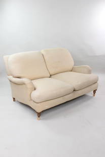 Upholstered Rolled Arm Sofa, Lee Industries: Upholstered Rolled Arm Sofa, Lee Industries. This two-seater sofa has a tan fabric . The wooden legs have added pieces to boost the seat up higher, these added pieces of would could be removed. It has
