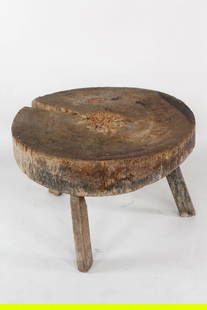 Primitive Round Wooden Peg Leg Butcher Block Coffee Table: Primitive Round Wooden Peg Leg Butcher Block Coffee Table. Round table with top made from a very thick round slab of wood. Stands on 3 peg legs.. Dimensions are 25.75 in h x 34 in w x 34 in d. Conditi