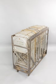 Industrial Rolling Rack Full of 25 Metal Folding Chairs, Brewer-Tichner Co.