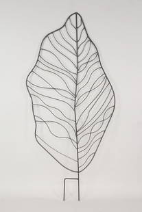 Large Wrought Iron Leaf Sculpture Garden Trellis: Large Wrought Iron Leaf Sculpture Garden Trellis. This leaf shaped trellis has two prongs to stick into the ground. It has a Mid Century Modern vibe to it. Dimensions including the prongs are 73 in h