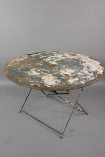 Metal Folding Outdoor Table, Heavy Patina: Metal Folding Outdoor Table, Heavy Patina. This green, white and rust table has folding legs. Looks like a cafe table with hole in the middle for umbrella. Dimensions are 28 in h x 46 in w x 46 in d.