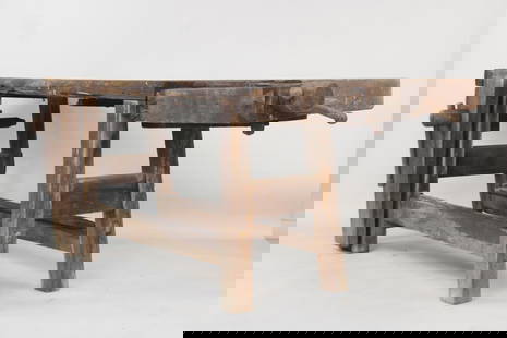 Large Primitive Wooden Carpenter's Workbench with Vise: Large Primitive Industrial Wooden Workbench with Vise. This studio, workshop or garage work table has a plank top surface with holes for holding tools, an iron and wood vise on the side, and a trough