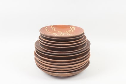 Group of 14 Redware Slip Decorated Plates