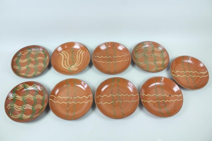 Group of 9 Redware Slip Decorated Plates