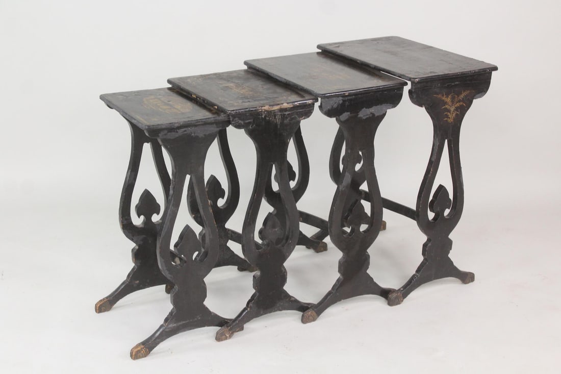 Set of 4 Black Lacquer & Gilt Chinoiserie Nesting Tables: Set of 4 Black Lacquer & Gilt Asian Chinoiserie Nesting Tables. Graduated set of wooden tables with lyre sides, black lacquer finish and gilt chinoiserie scenes on the tops. Dimensions are 25.5 in h x