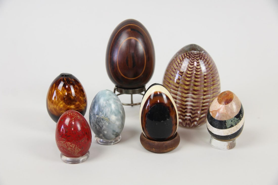 Collection of 7 Decorative Eggs, Murano, Stone & Wood: Collection of 7 Decorative Eggs, Murano, Stone & Wood. Seven eggs in a variety of materials including Murano glass with iridescent gold stripes, striped wood, mixed striped stone, jasper and possibly