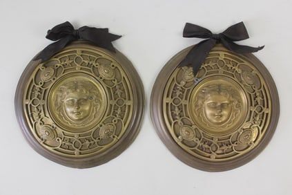 Pair of Bronze Decorative Wall Plaques with a Woman's Face