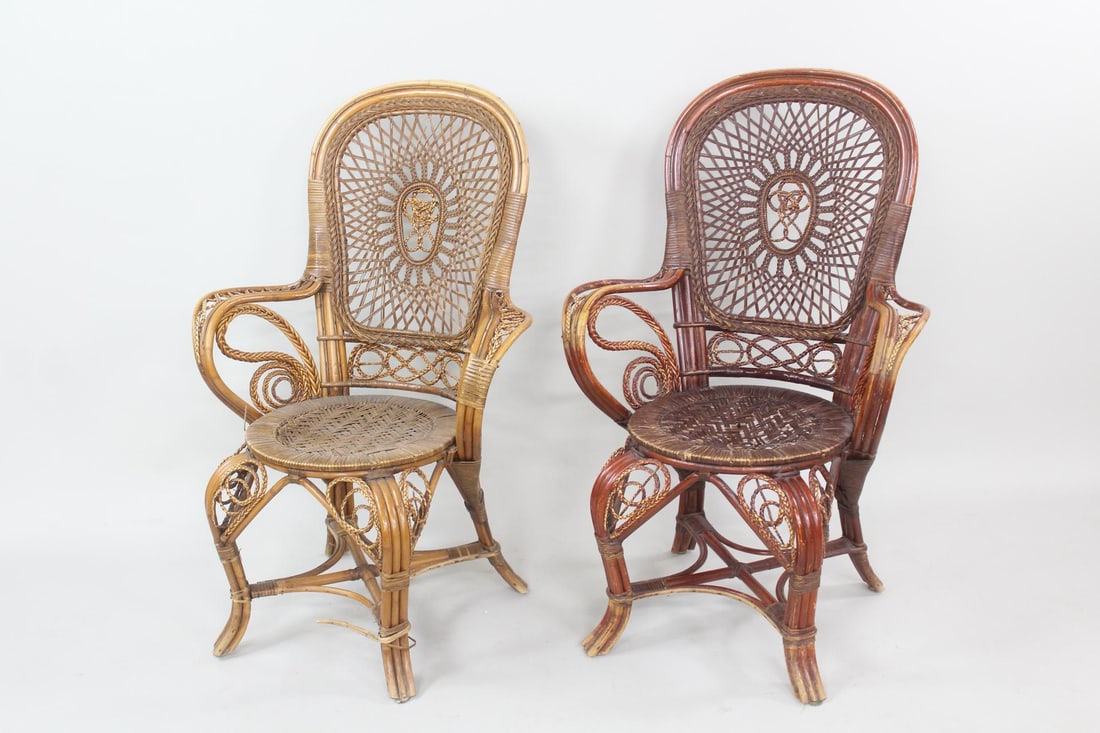 Pair of Swedish Woven Wicker Chairs: Pair of Swedish Woven Wicker Chairs. Matching pair of armchairs in 2 colors, ornately woven in bamboo and wicker. Dimensions are 41 in h x 28 in w x 24 in d. Seat height is 17.5 in. Condition is fair