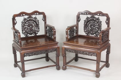 Pair of Chinese Carved Fruitwood Chairs with Fu Dogs