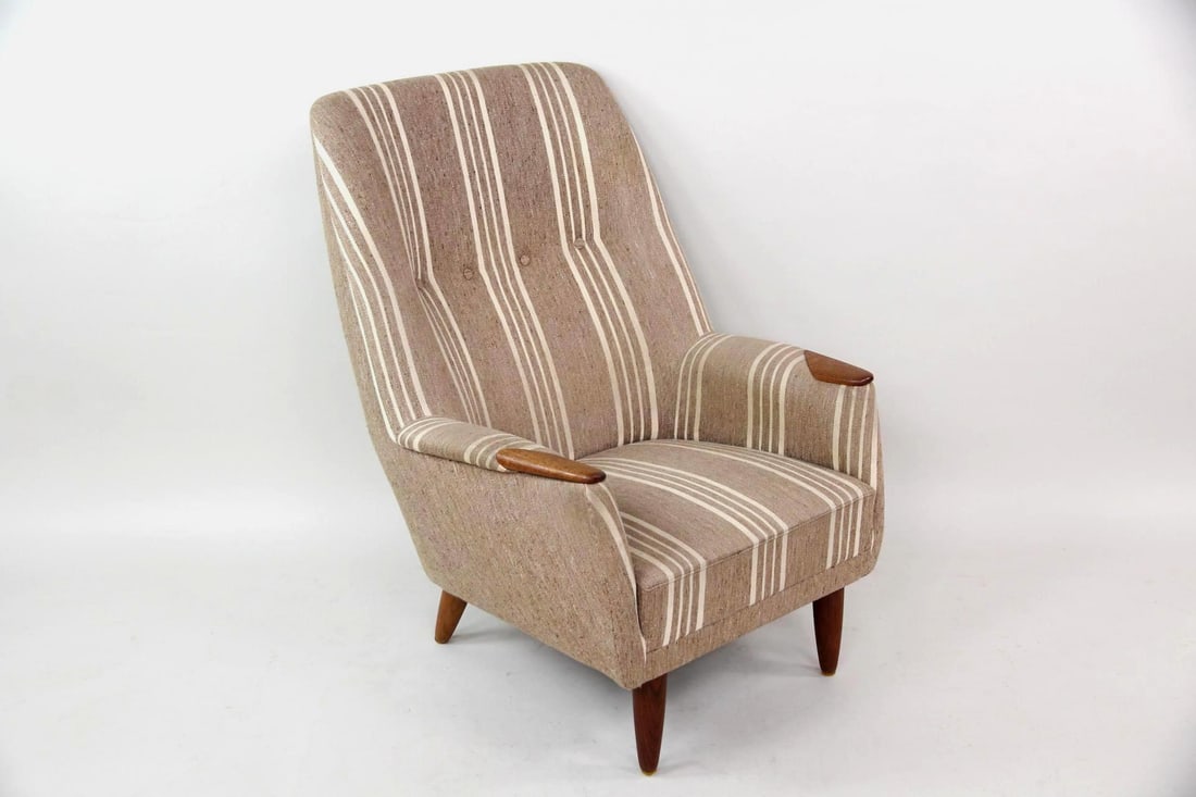 Danish Modern High Back Lounge Chair, Striped Upholstery: Mid-century Modern High Back Armchair. A sculptural lounge chair with a deep, relaxed profile. It has gray oatmeal & cream striped upholstery and armrests & tapered legs made of wood, possibly teak. U