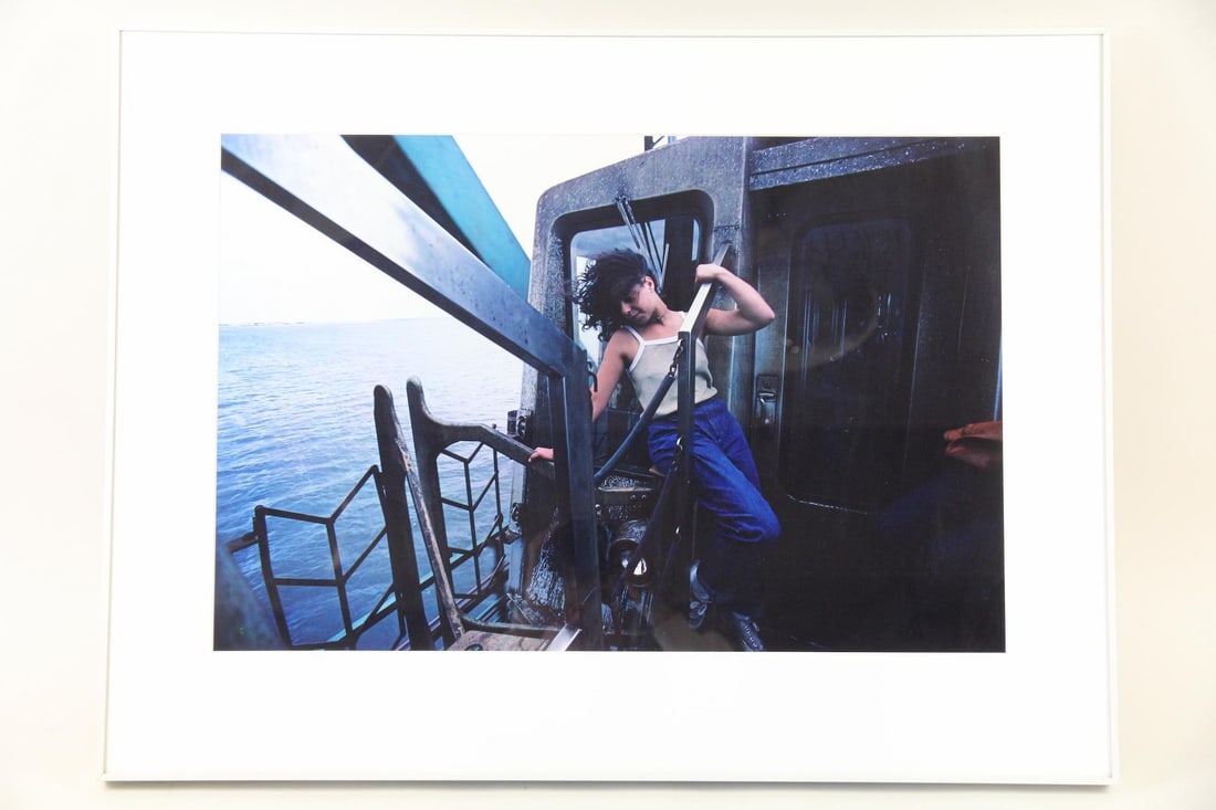 Bruce Davidson Photo, NYC Subway: Bruce Davidson Photo, NYC Subway. A color photograph by celebrated documentary photographer Bruce Davidson (b. 1933, Illinois) of a young woman outside of a subway car in Jamaica Bay, Queens. The imag