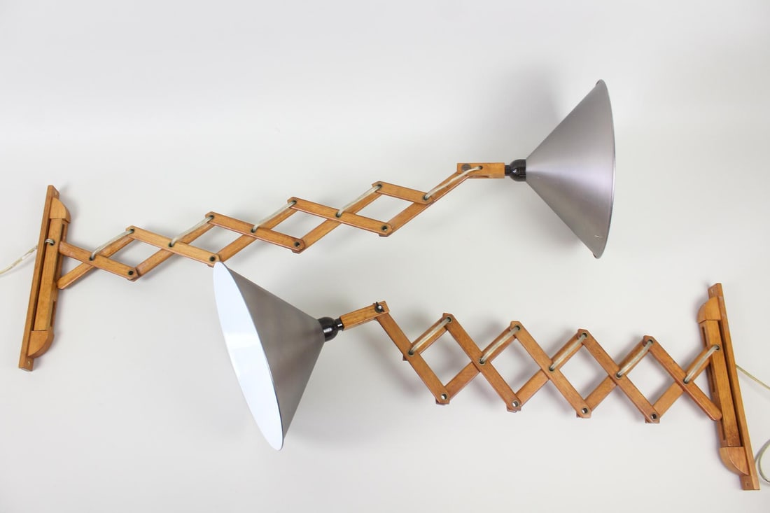 Pair of Scandinavian Modern Teak Scissor Wall Lamps: Pair of Scandinavian Mid-Century Modern Teak Scissor Wall Lamps. Matching pair of wall mounted extendable lights with teak wood accordion bodies that adjust for length, and silver tone metal cone shad