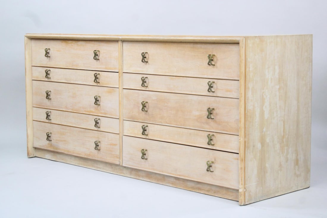 Dresser by Paul Frankl for Johnson Furniture Co.: Mid-century Modern Double Dresser Chest of Drawers, Paul Frankl. A spacious double dresser with ten total drawers in two different heights. It is made of pale, blonde wood and has crisscross brass pul