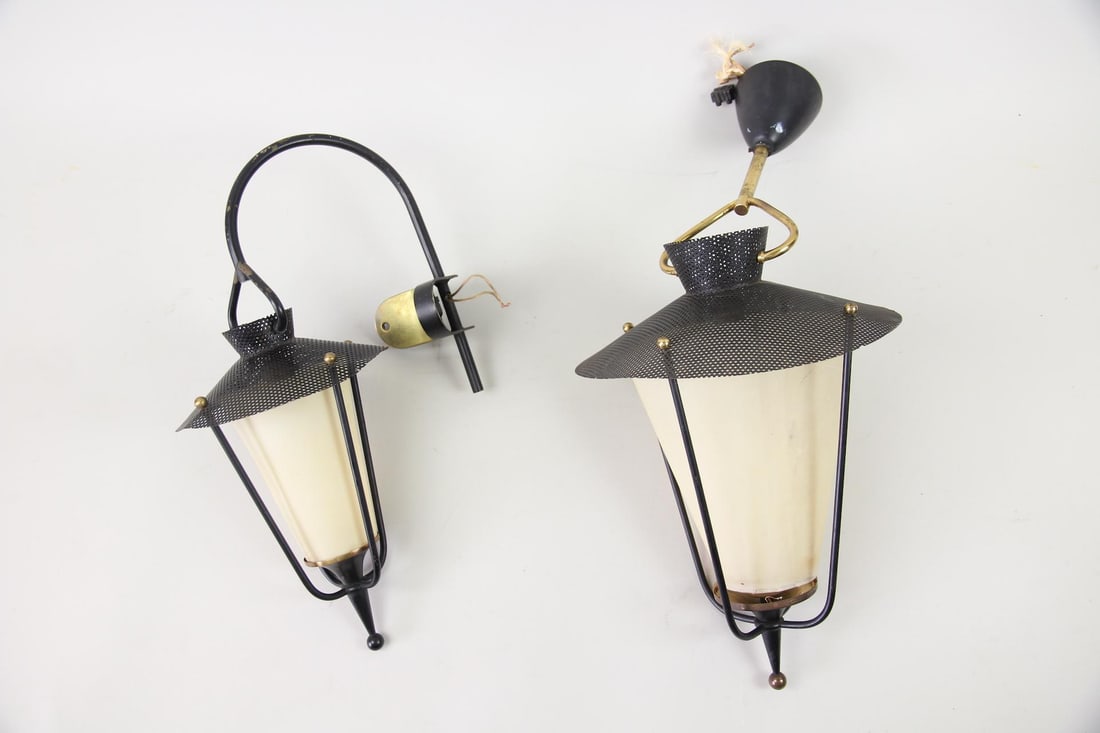 Lot of 2 Black & Brass Perforated Light Fixtures, Manner of Maison Arlus: Lot of 2 Black & Brass Light Fixtures, Manner of Maison Arlus. Two light fixtures with black perforated metal shades, brass accents and fiberglass shades. Each has a different type of mount, one a wal