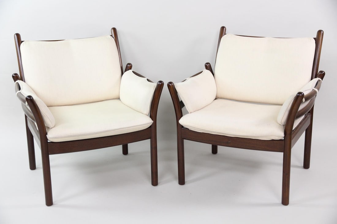 Pair of Illum Wikkelsø Rosewood Genius Lounge Chairs: Pair of Danish Mid-Century Modern Illum WikkelsIllum Wikkelsø for CFC Silkeborg Rosewood Genius Lounge Chairs. Matching pair of chairs with rosewood frames and removable cushions in oatmeal upholster