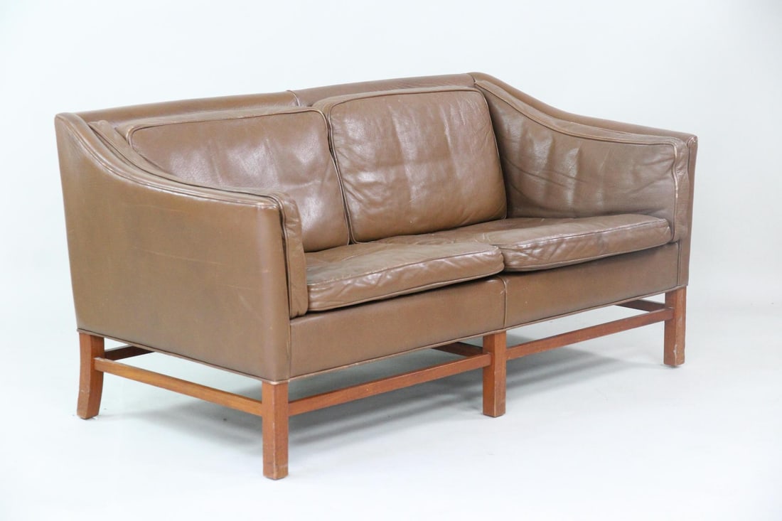 Danish Modern Brown Leather Sofa, Gunnar Grandt, 1 of 2: Mid-Century Modern Leather Sofa Loveseat, attri. Gunnar Grandt. This sofa has a box-like structure with gently sloping arms and a warm wood frame. Upholstered in cocoa colored leather. Unmarked, we be