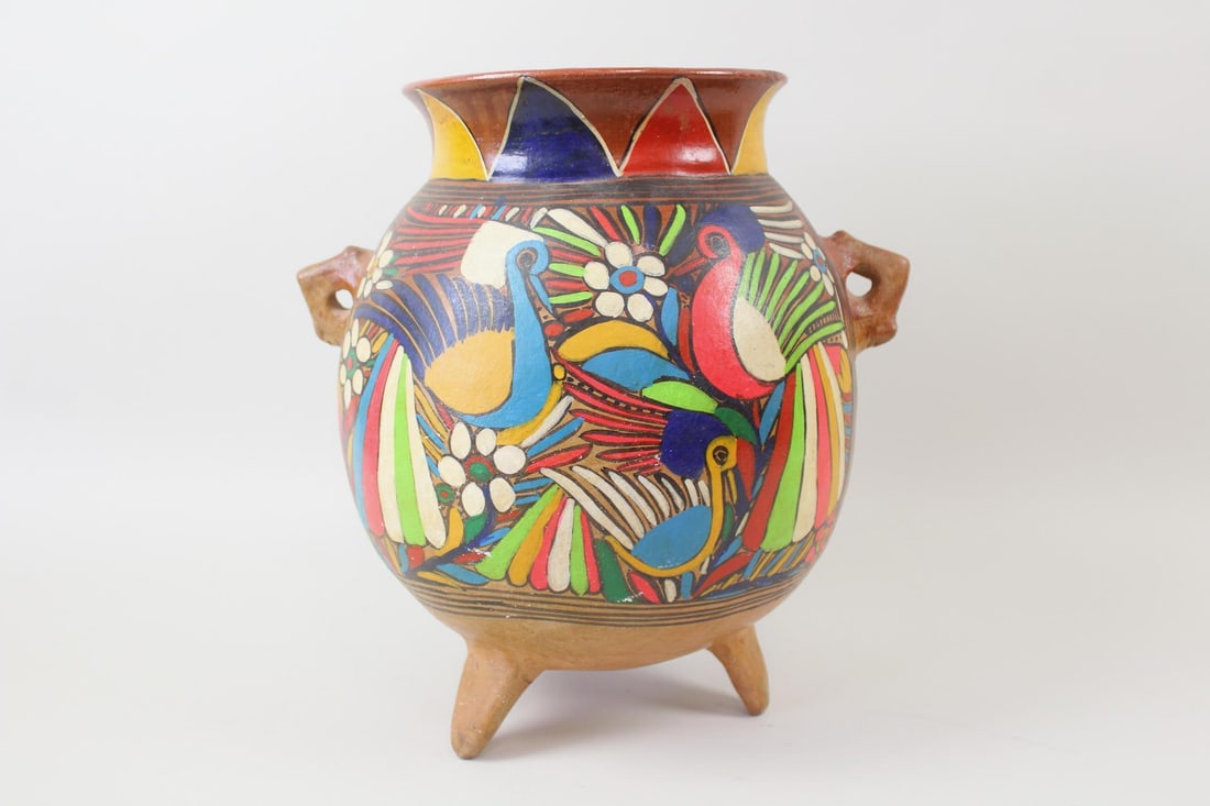 Mexican Talavera Pottery Footed Planter, Peacocks & Flowers: Mexican Folk Art Earthenware Pottery Planter. Colorful pot or planter sitting on three feet with two small handles and bright hand painted birds & flora. Dimensions are 15.75 in h x 15.25 in w x 12.5
