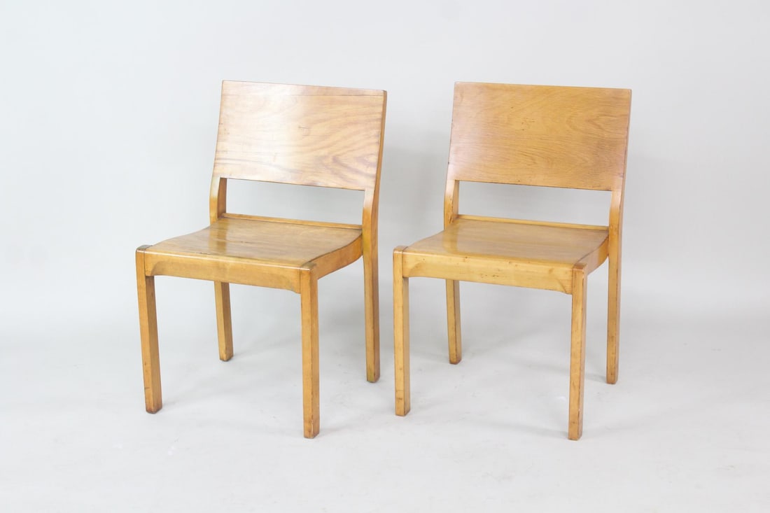 Pair of Alvar Aalto Stacking "No 611" Plywood Chairs: Pair of Alvar Aalto Stacking "No 61" Plywood Chairs. Matching pair of birch and plywood chairs designed by Alvar Aalto for Finmar, with no labels. Dimensions are 31.25 in h x 19.25 in w x 20.25 in d.