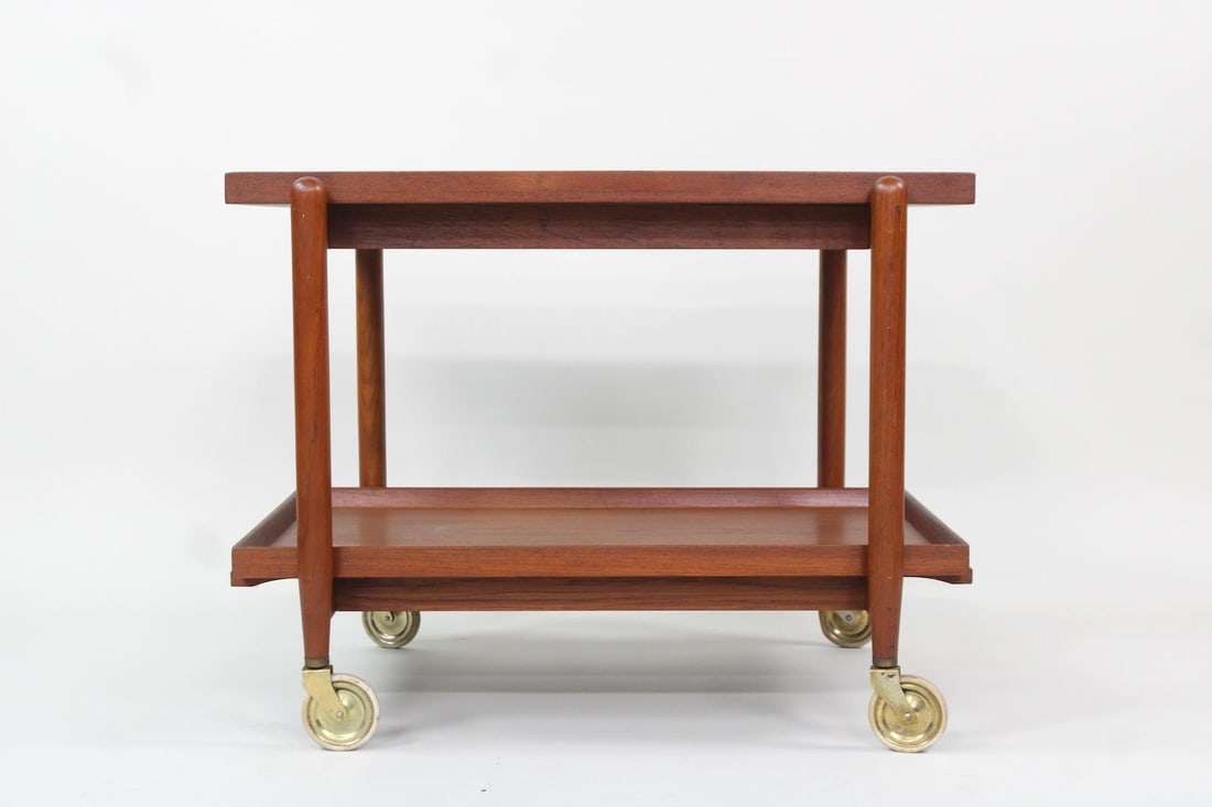 2-Tier Teak Expandable Bar Cart, Poul Hundevad: Danish Mid-century Modern Wooden Bar Trolley. Beautiful warm teak wood tray table equipped with slim wheels and two identical trays; the top tray slides outwards and the bottom can be placed next to i